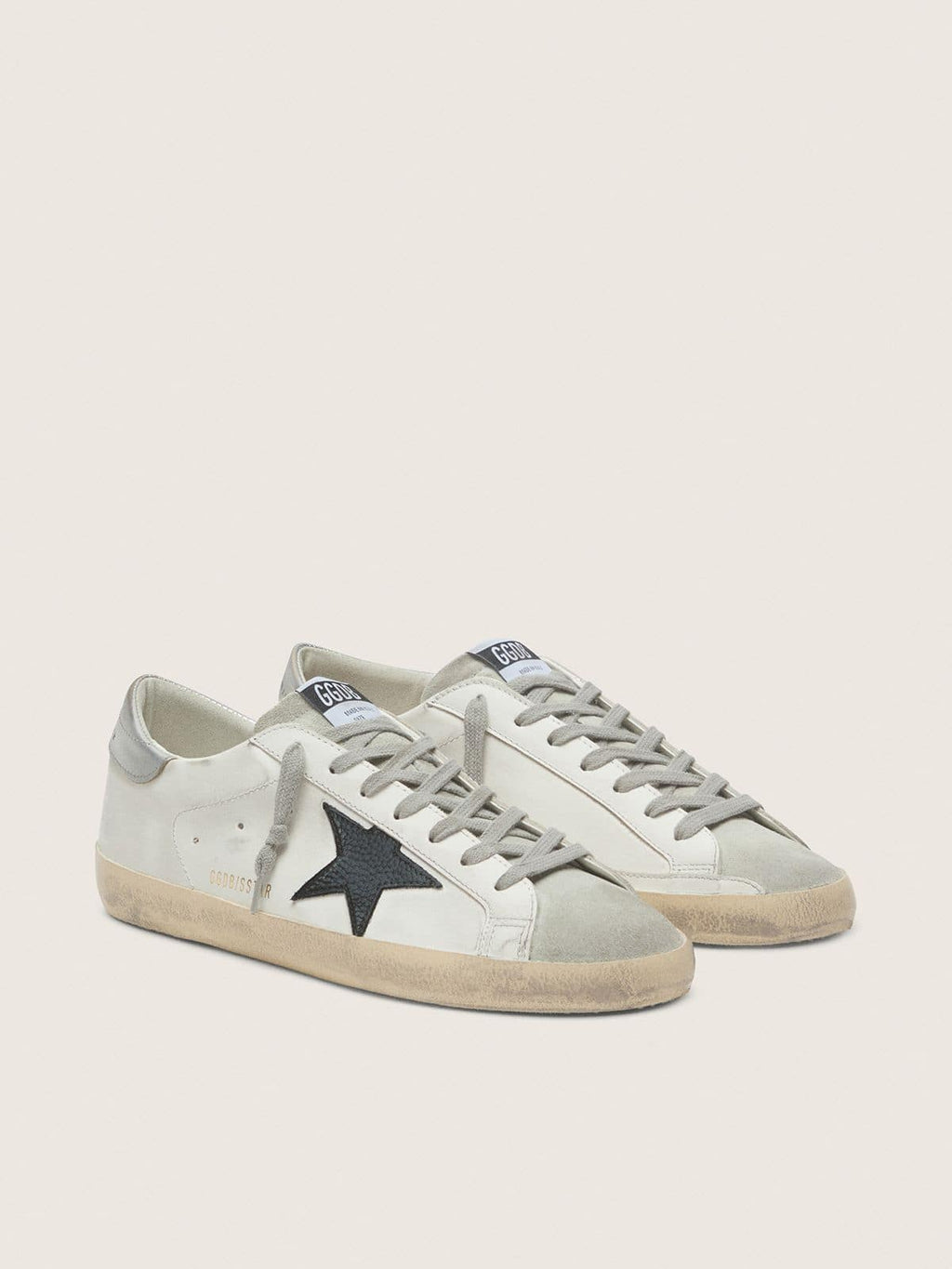 Golden Goose Super-Star Uomo in Pelle Bianca con Stella in Pelle Nabuk Nera e Talloncino in Pelle Laminata Argento