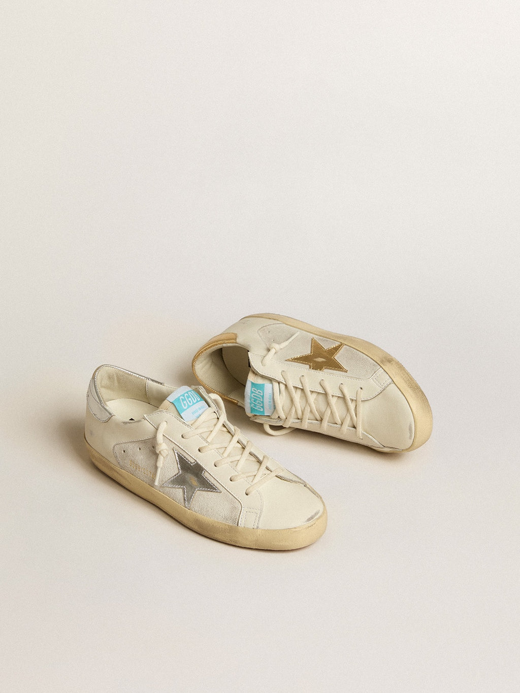 Golden Goose Super-Star in Pelle e Suede Bianchi con Stella in Pelle Argento e Oro