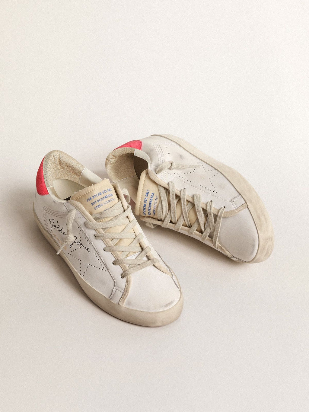 Golden Goose Super-Star Donna in Pelle Bianca con Stella Traforata e Talloncino in Nylon Fucsia